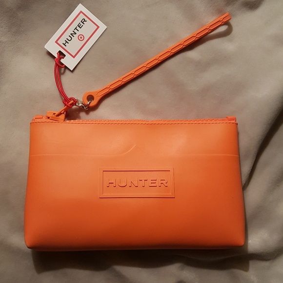 Hunter for Target Handbags - Hunter for Target NWT rubber clutch w/wrist strap